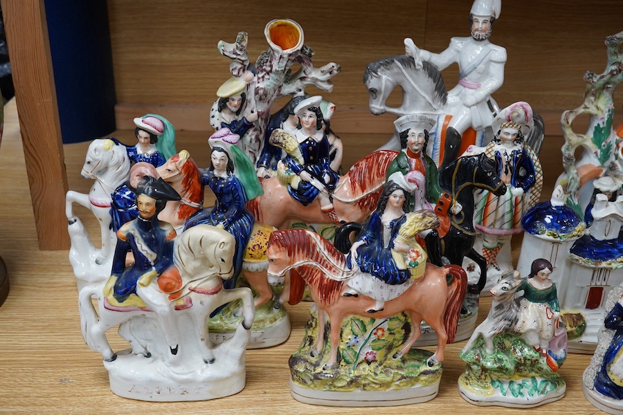 A collection of twenty Staffordshire flatback figures or models to include D. Turpin and Empress of France, largest 36cm high. Condition - fair, some restored